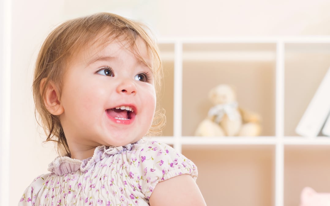 Happy toddler girl with a great big smile